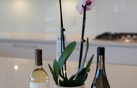 new residential construction - keys with flower, card and wine