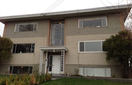 before apartment renovation - exterior stucco, front view