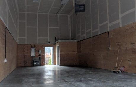 new commercial construction - bay with completed drywall